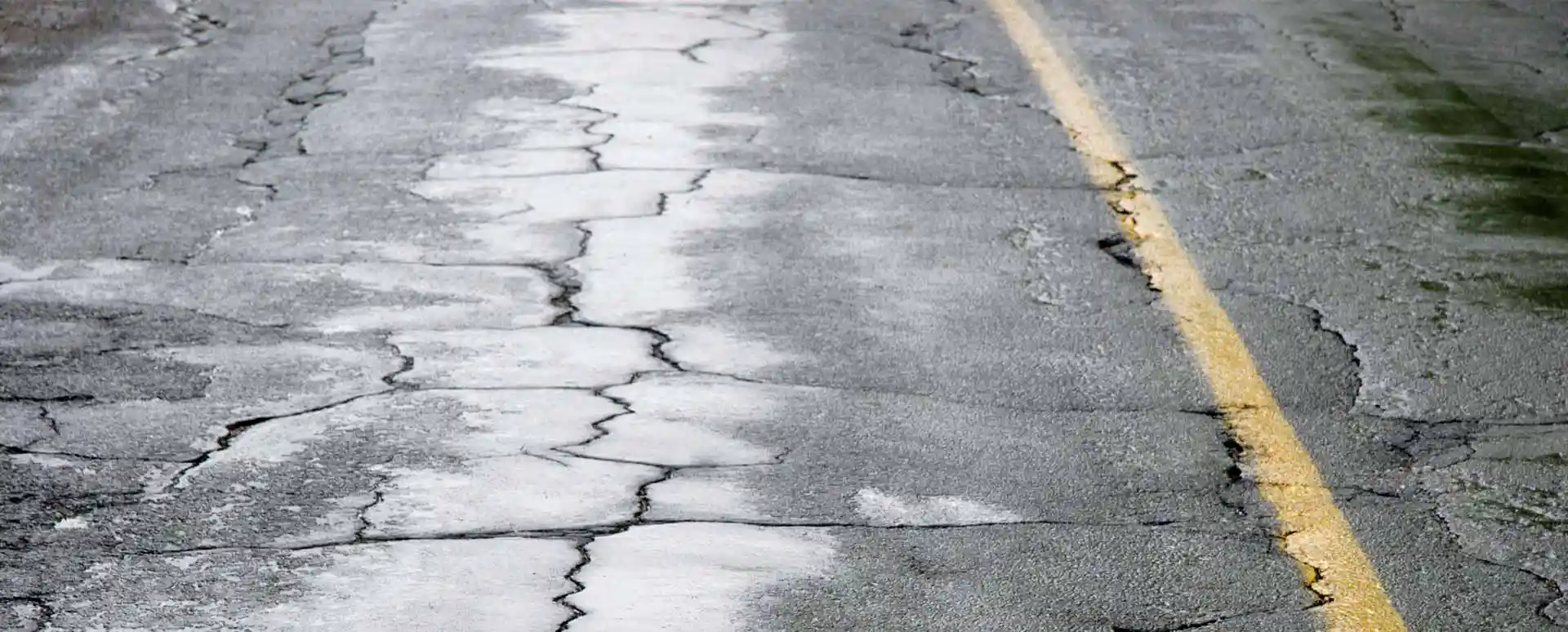 Road with cracked asphalt