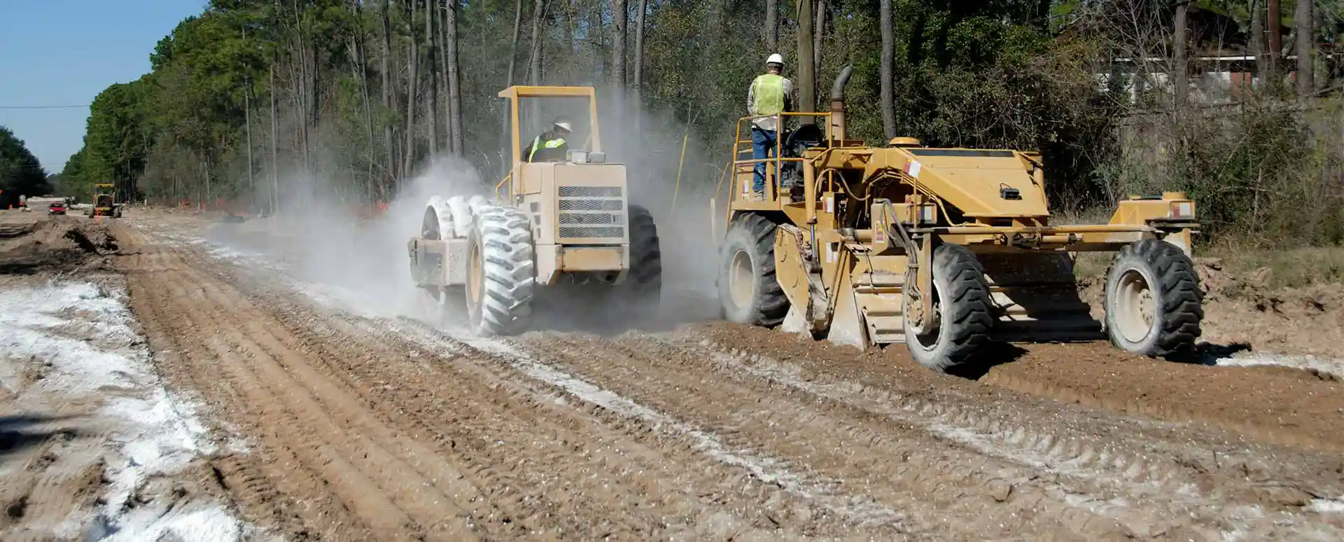 Road Construction- Tiller And Compactor Stabilizing The Soil