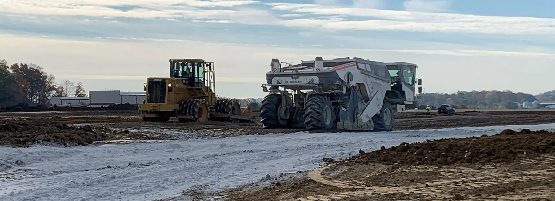 Soil being treated with lime on a worksite