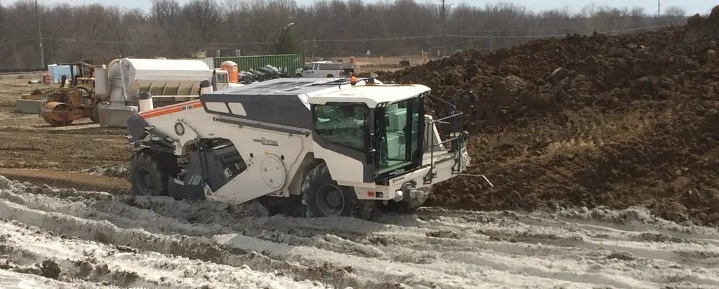 Soil reclaimer blending materials into soil