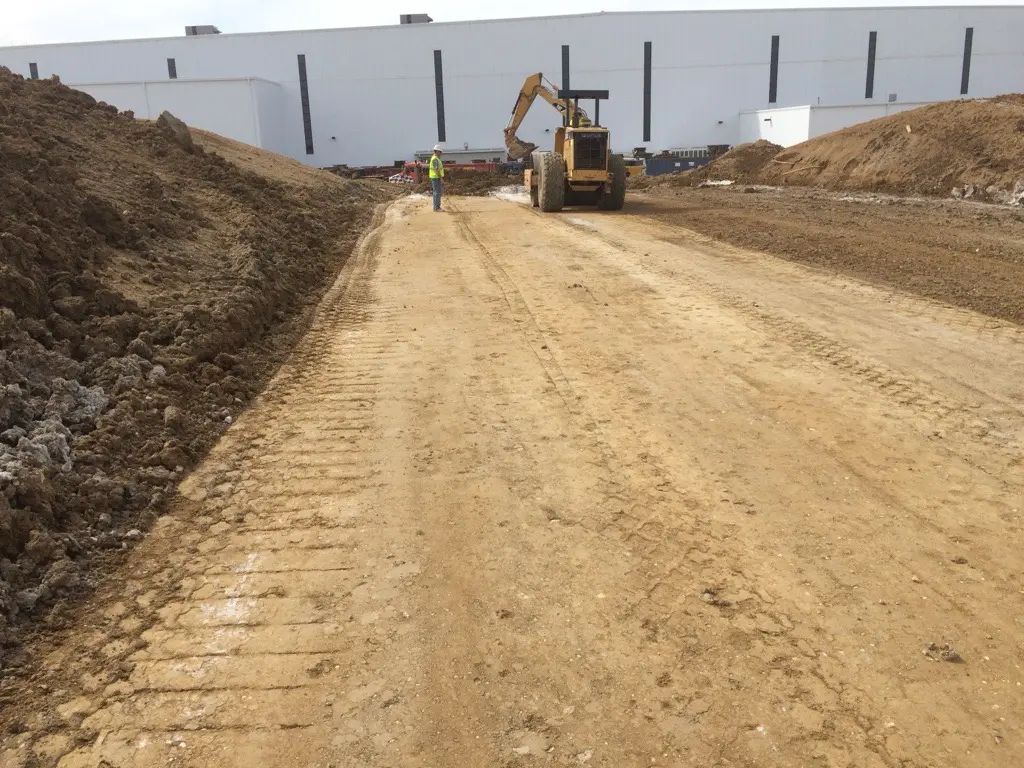 Soil being treated with lime on a worksite