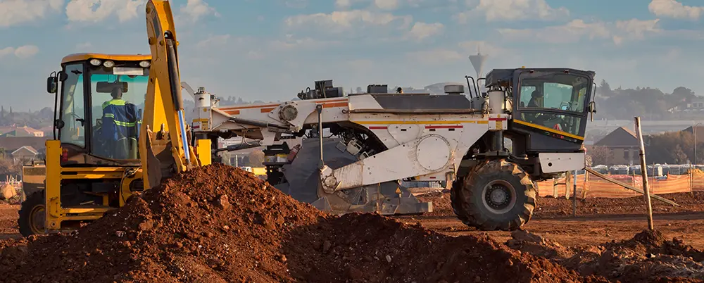 Spreader truck distributing materials uniformly across the treatment area at a project site.