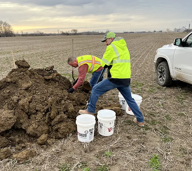 Team members pulling samples from different areas to evaluate soil variability across a project site.